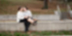 a queer couple canoodling in a park captured by a wedding photographer in charlottesville virginia