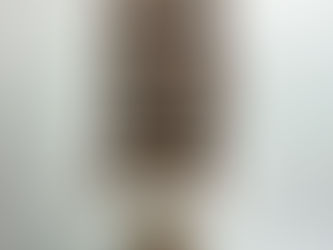 “Stack of five chocolate-caramel cereal bars on a small pedestal stand, photographed in natural light against a white background. Perfect example of a fun-sized snack that can trigger emotional eating or overeating, even when you’re not hungry.”
