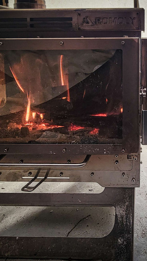 Pomoly Dweller Max 3 wood stove set up inside a tent