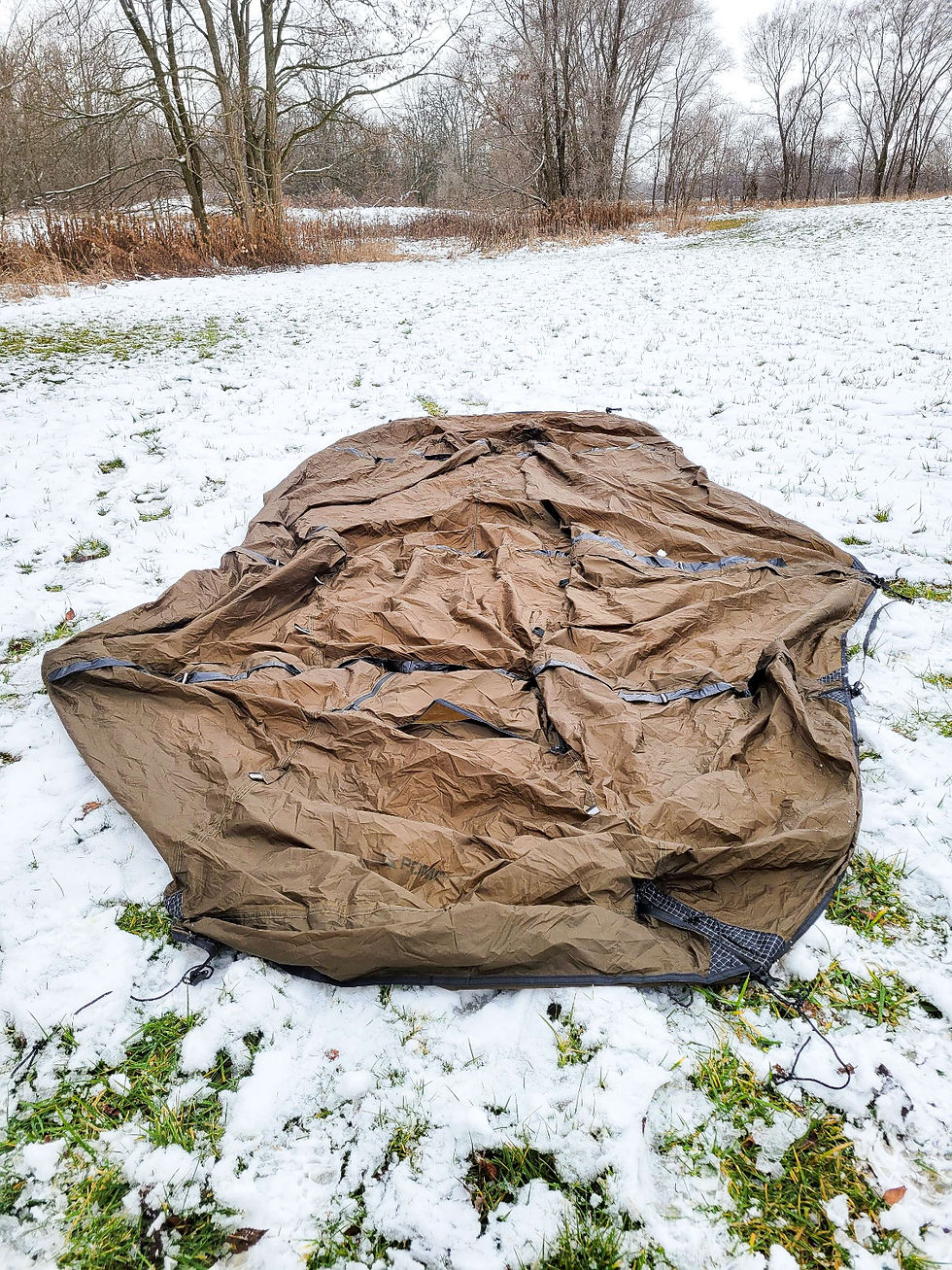 An image of a tent that is stretched out on the ground.