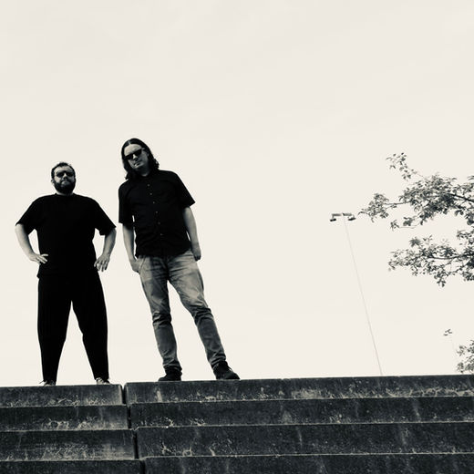 Georges-Emmanuel Schneider and Sascha Blach posing during a photo shoot in Berlin, 2024.