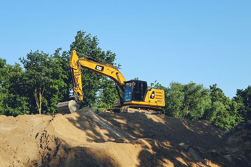 CAT EXCVATION ON DIRT PILE