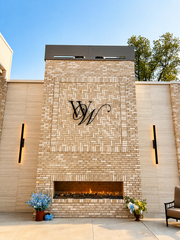 Stone fireplace featuring the Westwood, Vowery and Estate monogram in Westfield, Indiana