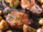 Pork Chop with slices of Potatoes