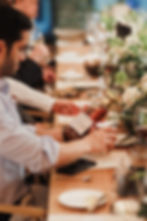 Whisky Tasting with people sat round a table