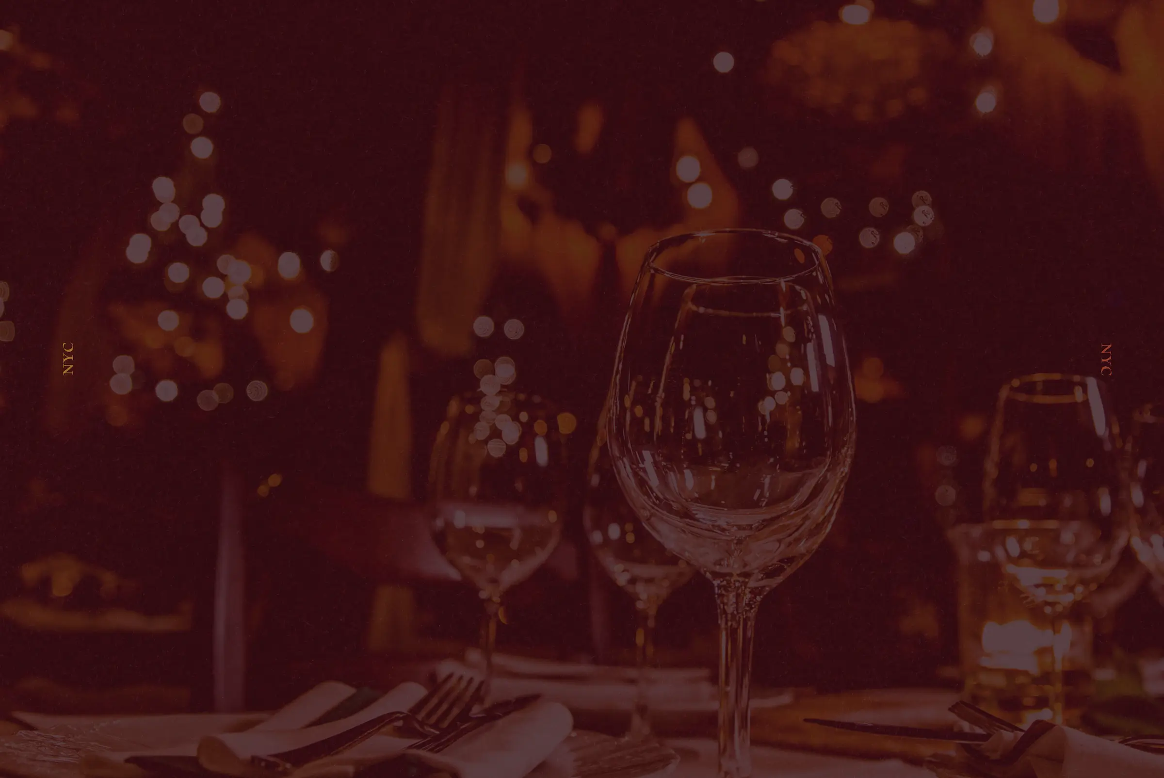 A warmly lit dining table at night