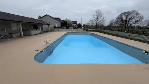 Front view of the pool at Dye’s Walk Country Club, highlighting newly painted deck and interior surface.