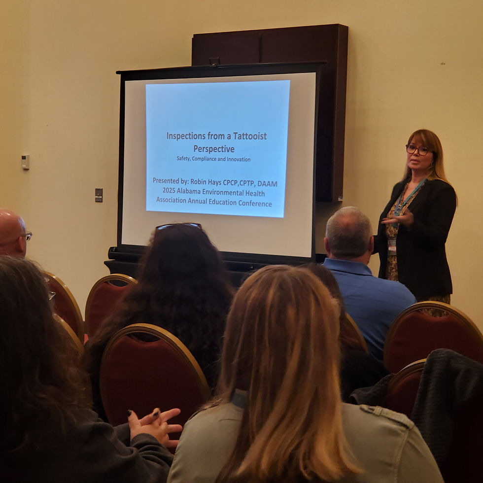 Robin Hays presenting a lecture on tattoo safety and compliance