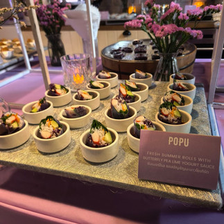Branded catering and refreshment area for participants at POPU Masterclass Thailand 2026 in Bangkok, featuring custom snacks and hospitality during the international educational event dedicated to permanent makeup (PMU).