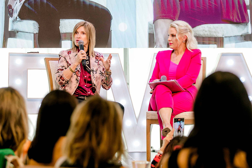Teryn Darling speaking on a panel about permanent makeup education and the future of the PMU industry at an international conference.