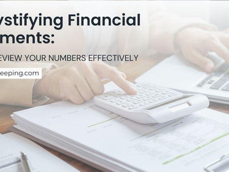 Small business owner reviewing financial statements