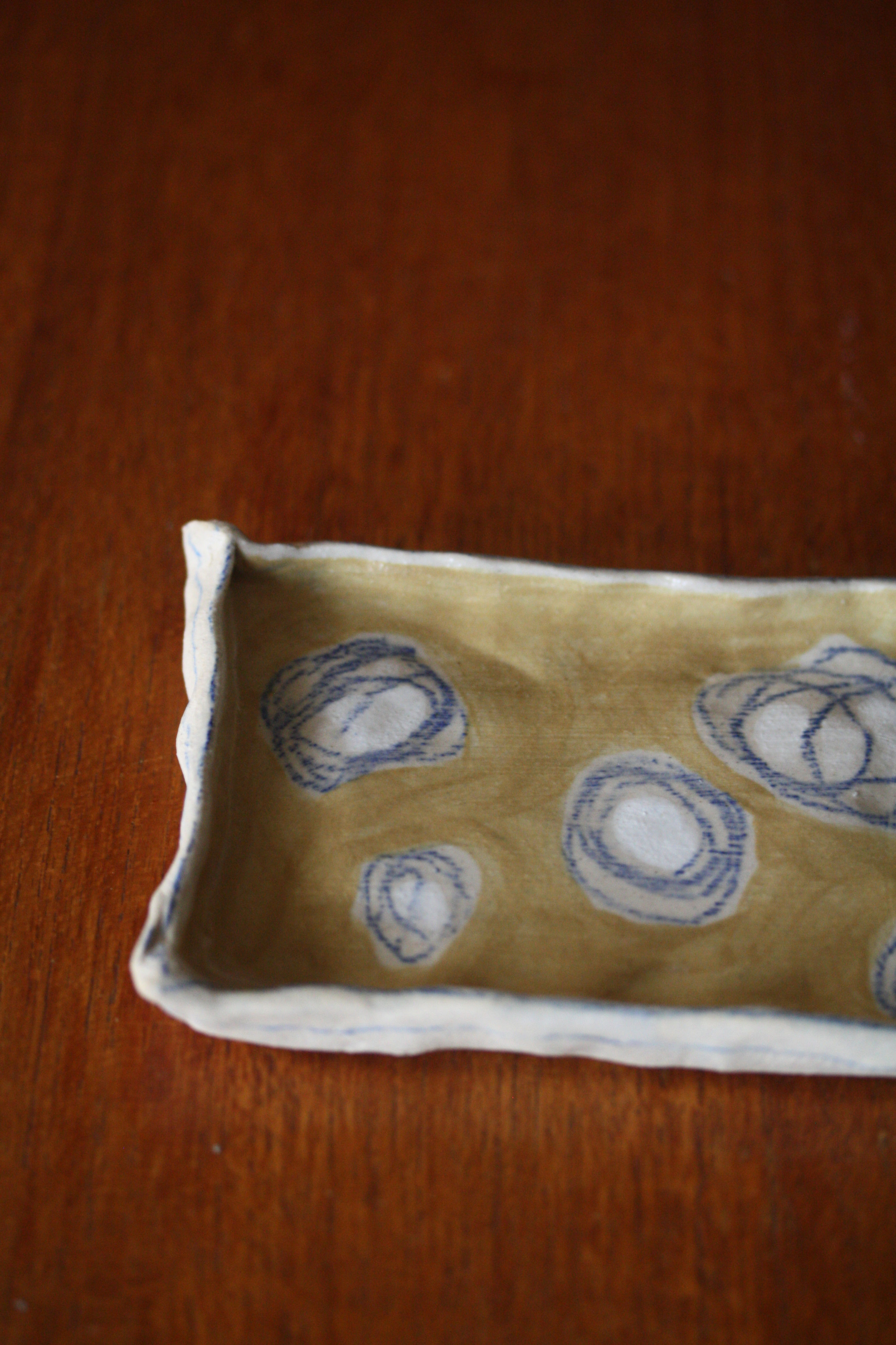 Mustard and blue trinket dish