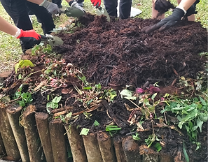 Colleagues making hot compost together