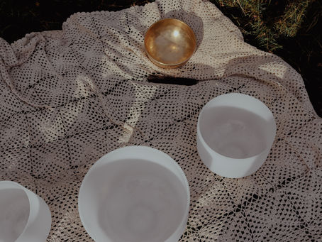 Quartz Crystal Sound Bowls & Himalayan Metal Bowl on a crochet blanket.