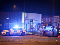 Man, 20, arrested after car flips on its side following police chase