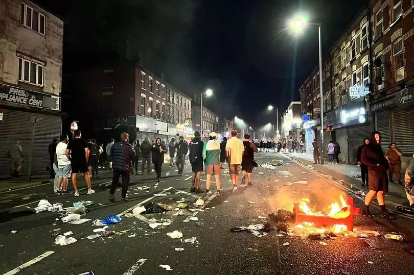 Thugs attacked police, looted shops and set Spellow Library on fire (Image: Liverpool Echo)