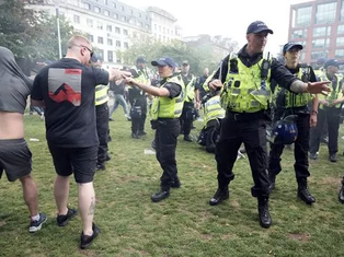 Clashes erupt in Piccadilly Gardens as demonstrators pour into the heart of Manchester.