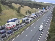 Man dies after car hits central reservation on the M62