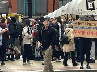 Crowds gather outside mayor Andy Burnham's offices in protest over GMP Manchester Airport video