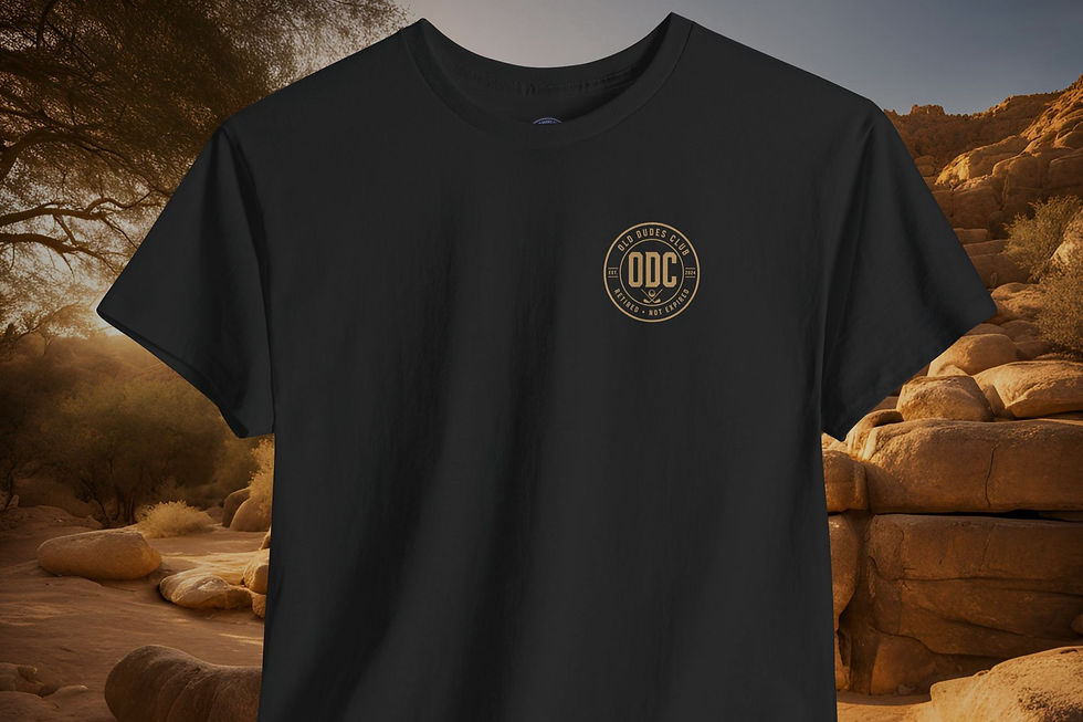 Thumbnail: black tee with Old Dudes Club Circular logo printed in tan on he upper left chest