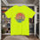 Thumbnail: safety green t-shirt Old Dudes Club over a beach theme circular back ground