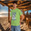 Thumbnail: lime green tee shirt with a large fish jumping chasing a lure with Fishing printed above the fish and Lifestyle below