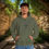 Thumbnail: green hoodie with Godfidence, Knowing I Can't But He can printed in black with large 3 nail style cross