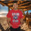 Thumbnail: red tee with The Full Armor Of God printed in blue and silver also an image of a Knight's Armor