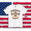 Thumbnail: white colored T-Shirt with a colorful graphic similar to an old University design