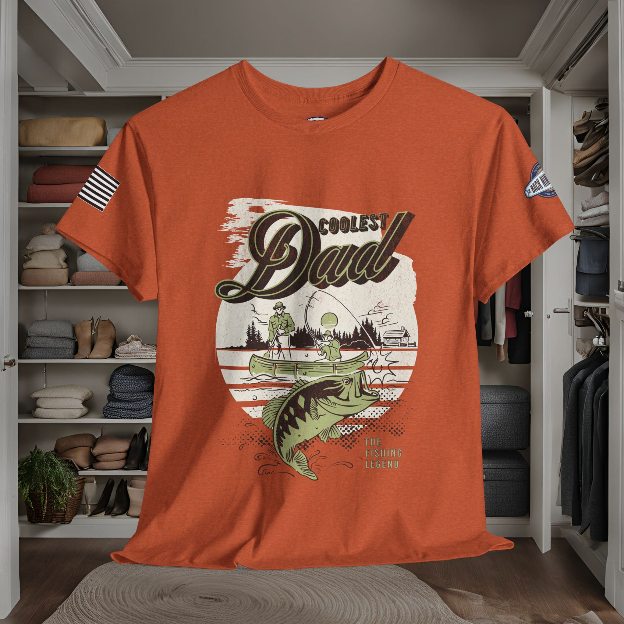 orange tee shirt with the graphic design of two men fishing in a canoe with the words The Coolest Dad, The fishing legend