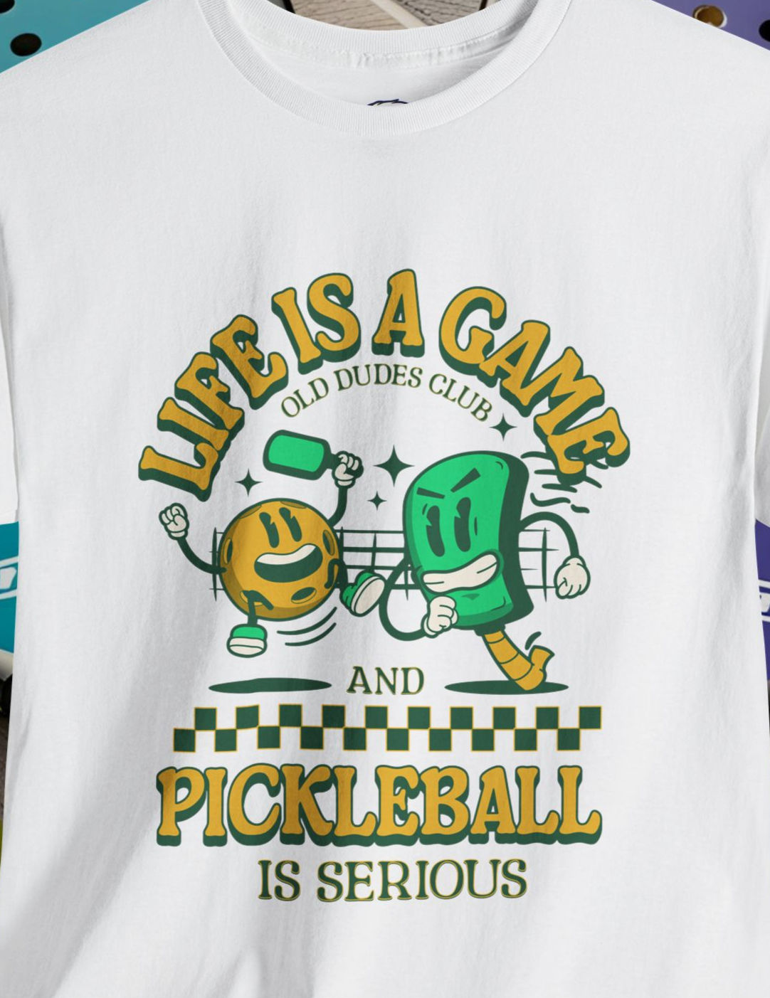 Front of a white tee shirt with Life is a Game..Pickleball is Serious! Old Dudes Club