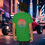 Thumbnail: green t-shirt Old Dudes Club over a beach theme circular back ground