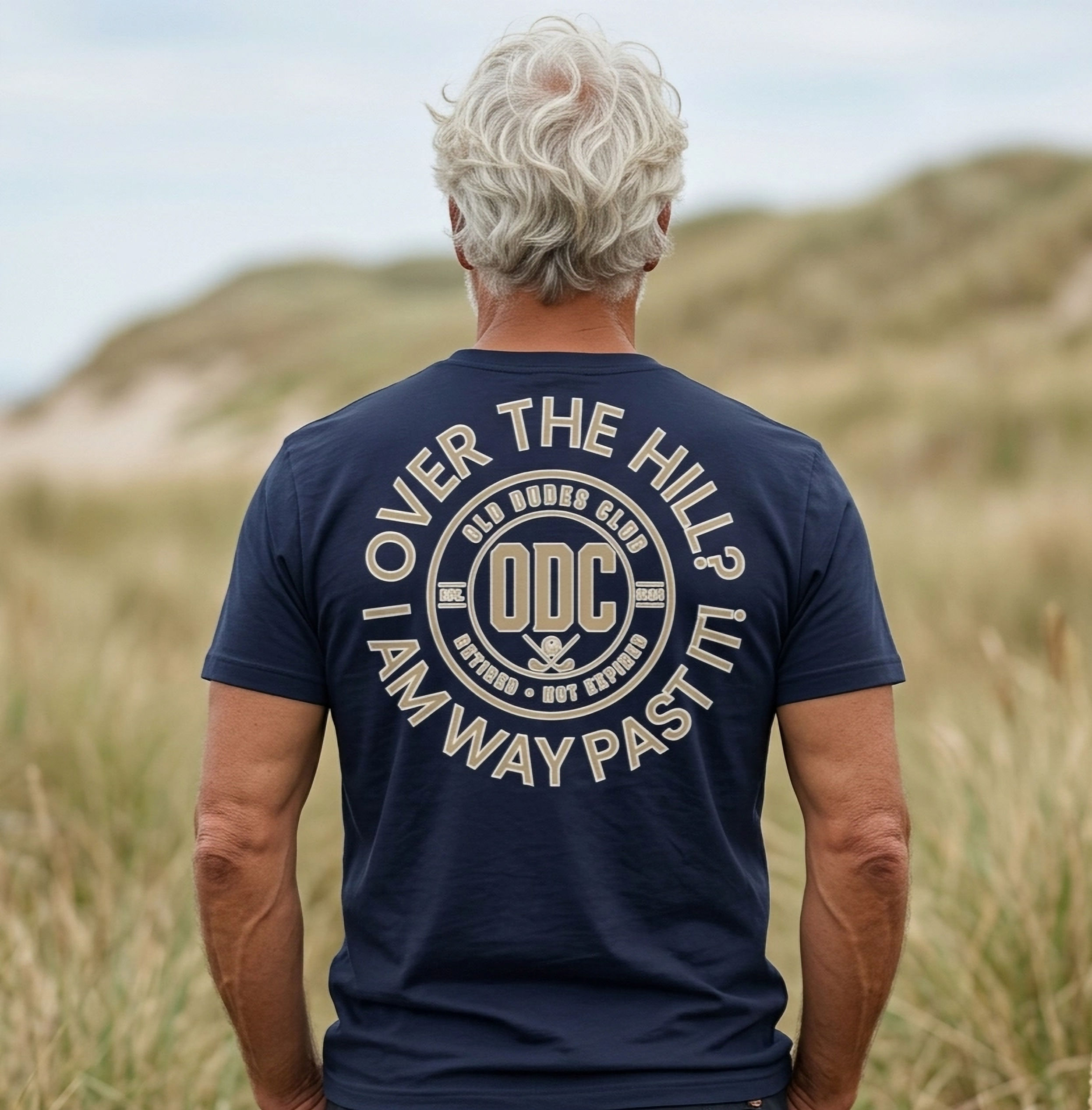 Navy colored tee with a printed design on the back Over The Hill? I'm way past it