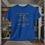 Thumbnail: blue tee shirt with "My Chains are Broken I have been set free" in gray letters an orange cross between broken chains