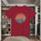 Thumbnail: red t-shirt Old Dudes Club over a beach theme circular back ground