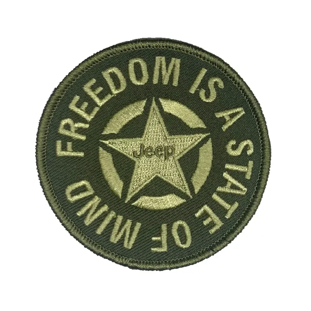 Round patch reads: Freedom is a state of mind, Jeep star logo.
