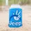 Thumbnail: Blue Jeep can cooler, white hand sign with peace symbol, sitting on sand