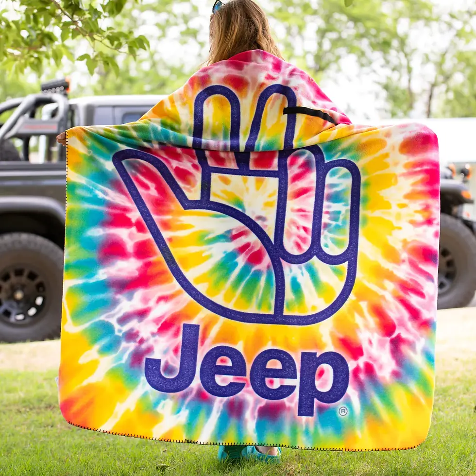 Thumbnail: Woman holds tie-dye Jeep blanket with peace sign, Jeep - Camo Duck T-Shirt 2381.