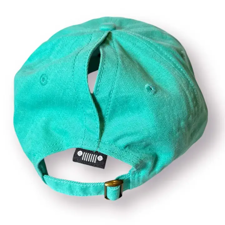 Thumbnail: Green hat with adjustable strap and logo on the back, up close.