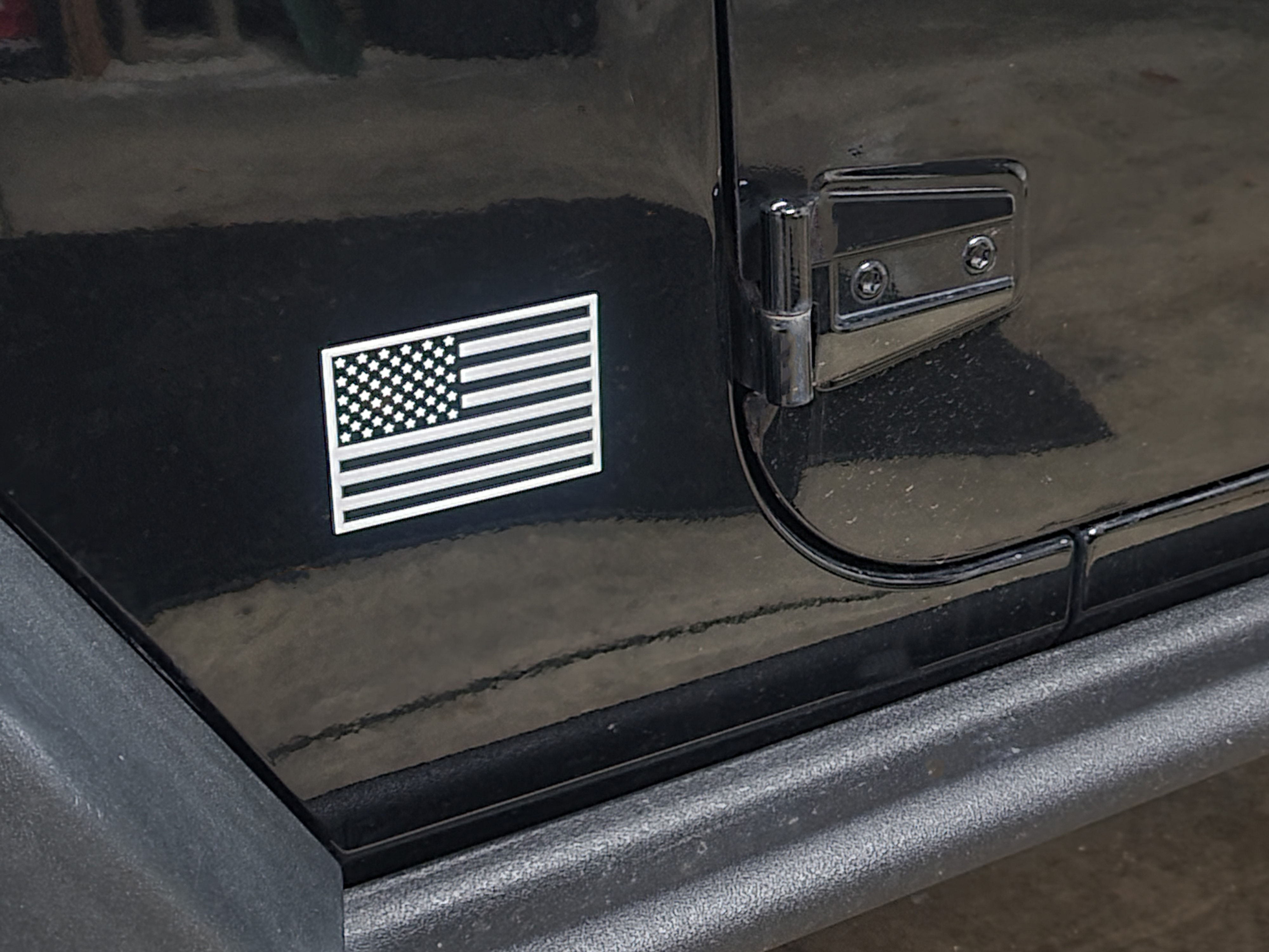 American flag sticker on a black Jeep door, United States of America