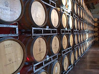 Wine barrels stacked in an orderly manner