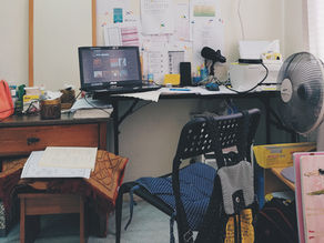 A cluttered study office space