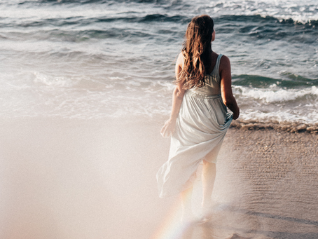 psychic walking towards the ocean