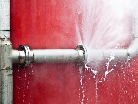 A pipe bursts, spraying water from the damaged line, causing significant leakage in Central Oregon