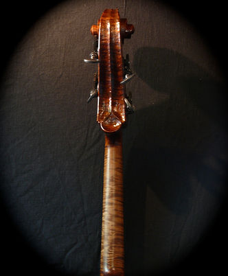 image of hand carved walnut bass neck and scroll©2017 by Seth Kimmel Bass maker/luthier of American made, real wood, hand-carved, double bass violins; Eugene, Oregon, USA