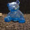 Thumbnail: Bright blue resin bear with a clear faceted surface, solid decorative figure with no lighting.