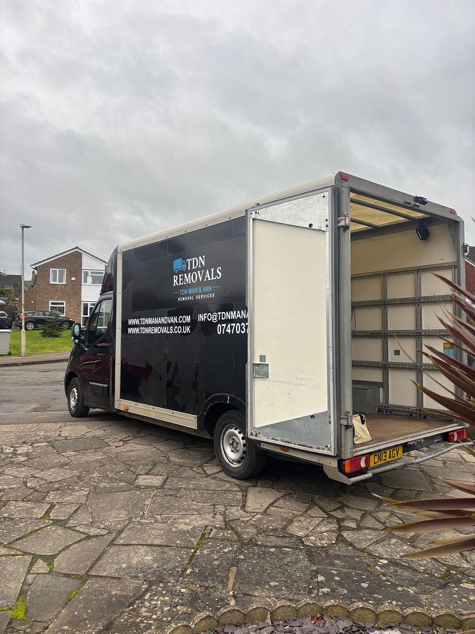 Eye-level view of a white van parked outside a residential house