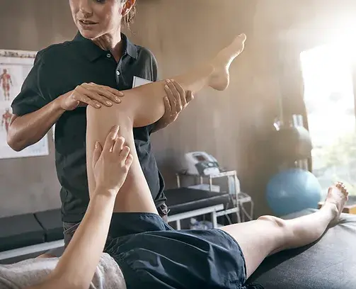Massage therapy session focusing on leg stretching.
