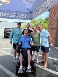 Matt Brown surrounded by Jack Doherty, Paul Wahlberg at the Dunk Tank Fundraiser