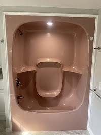Before photo showing a beige Jacuzzi in Winchester, MA